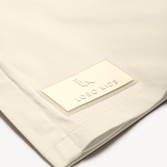 Cotton skort with box pleats and signature patch